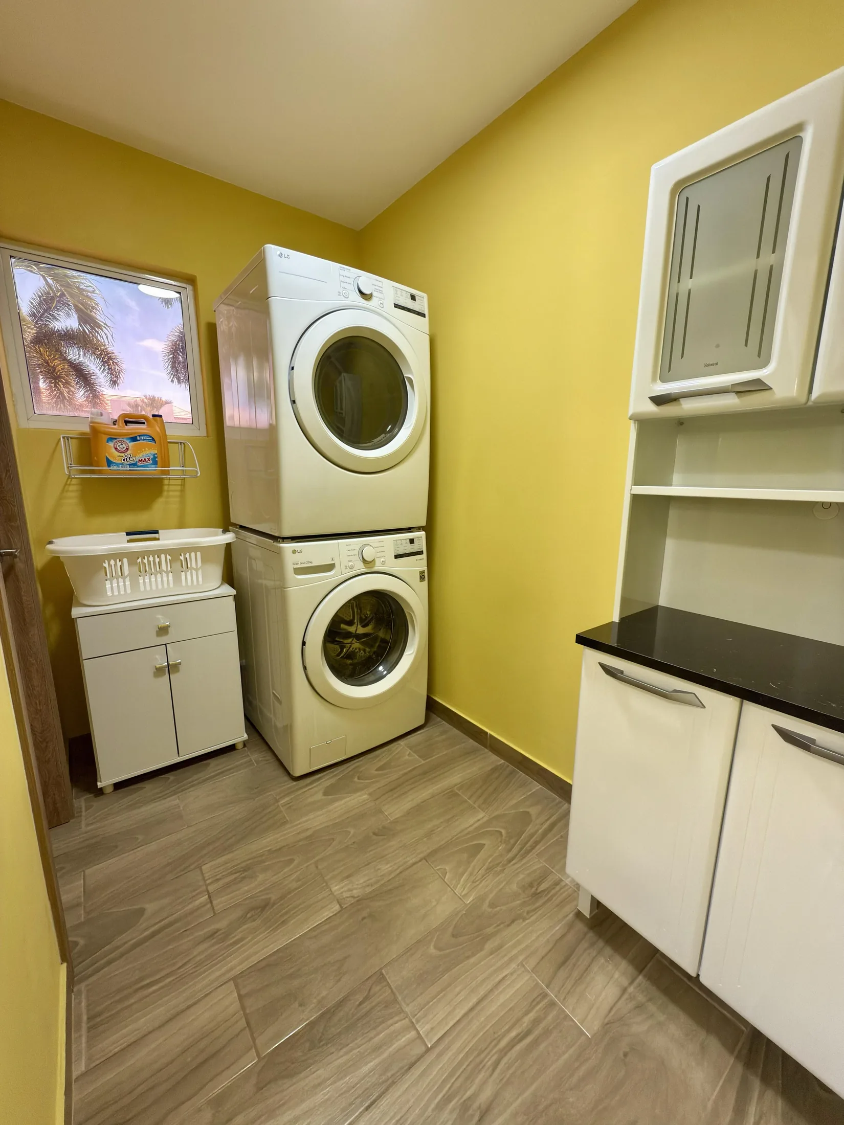 Modern Western style laundry room with direct dryer vent outside and plenty of space