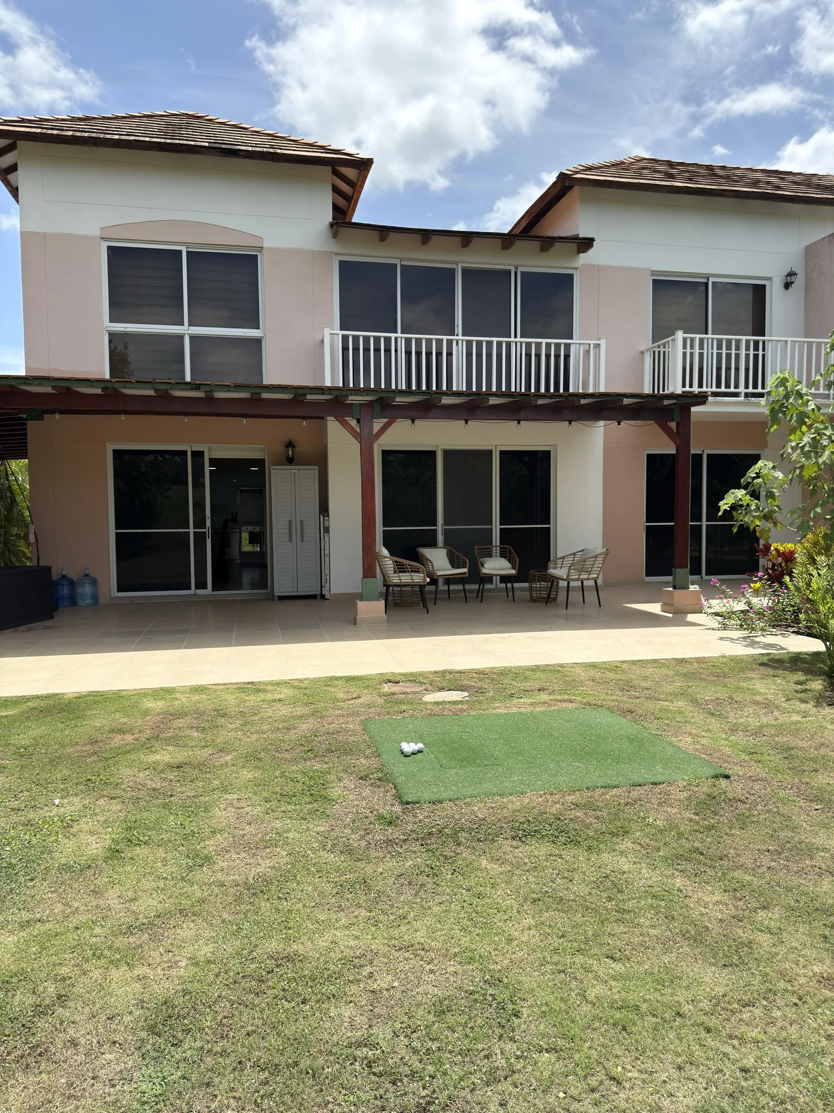 Leveled and raised golf mat ready for backyard golf or practice into a net